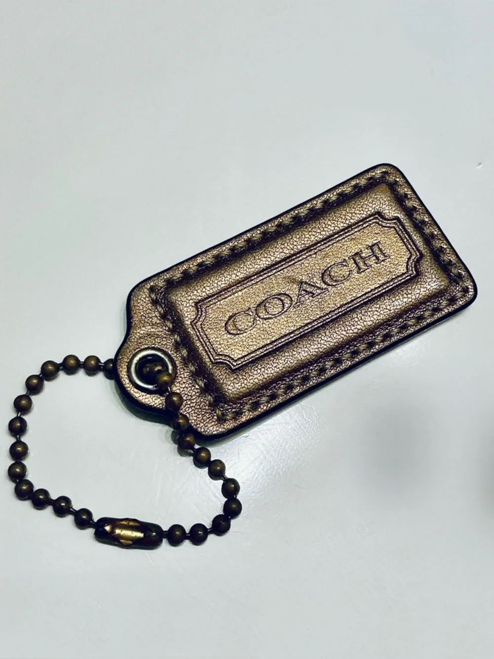 COACH Metallic Bronze, Gold Finish Replacement Hang Tag Bag Charm Fob